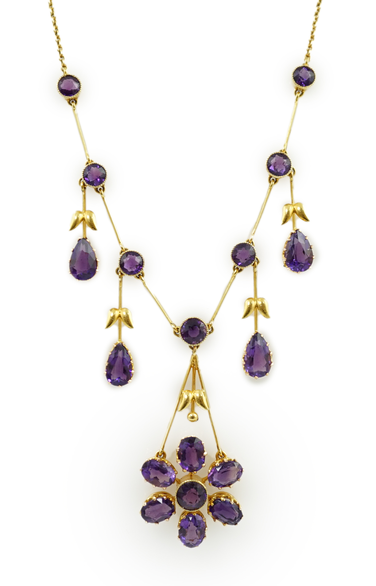 An Edwardian gold, and amethyst cluster drop pendant necklace